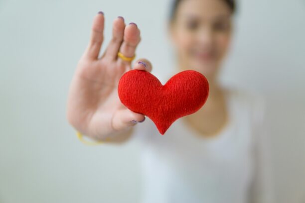 woman holding hear